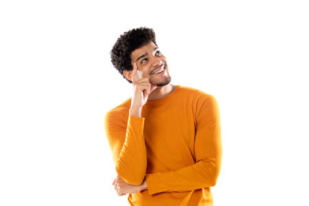 Young black afro man thinking, feeling doubtful and confused, with different options, wondering which decision to make isolated on a white backgroundの写真素材