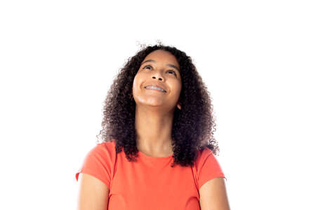 Beautiful african teenager with afro hair isolated on a white background
