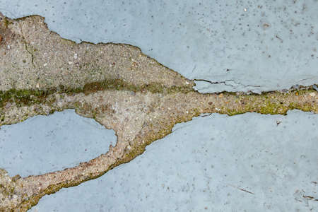 Abstract damaged gray wall with chipped paint on the surfaceの写真素材