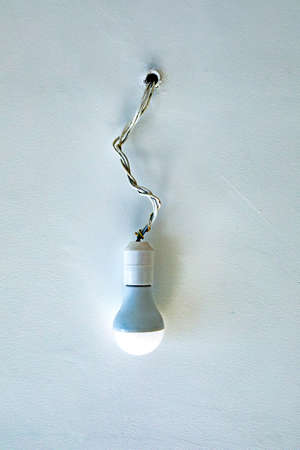 White Light isolated hanging on a wireの写真素材