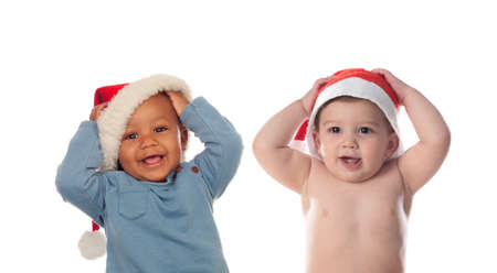 Adorable christmas children in a red hatの写真素材