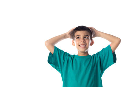 Astonished child with his hands on the head isolated on a white backgroundの写真素材