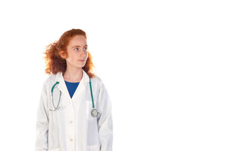 Redhead doctor woman laughing isolated on a white backgroundの写真素材