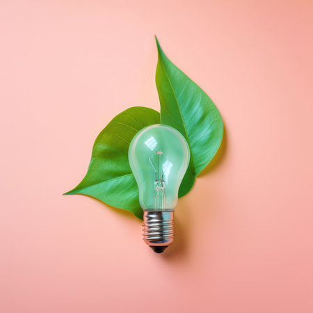 Renewable Energy and Sustainable Living concept depicted by a top view of an Eco-friendly lightbulb made of fresh leaves against a pastel colored backdrop by generative AIの素材