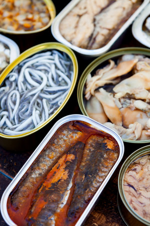 Assortment of open tin cans for a healthy dinnerの写真素材