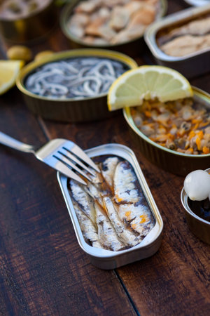 Assortment of open tin cans for a healthy dinnerの写真素材