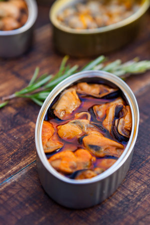 Assortment of open tin cans for a healthy dinnerの写真素材
