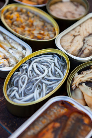 Assortment of open tin cans for a healthy dinnerの素材