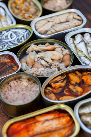 Assortment of open tin cans for a healthy dinnerの素材