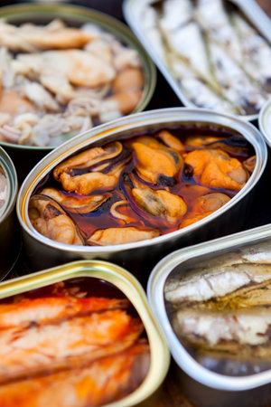 Assortment of open tin cans for a healthy dinnerの素材