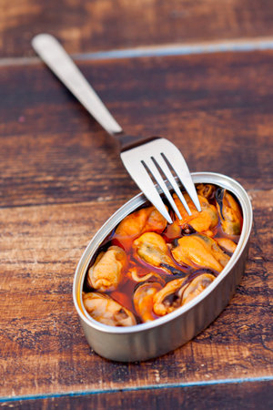 Canister of canned mussels. Healthy mealの素材