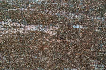 Texture of old rusty painted and worn brown metal