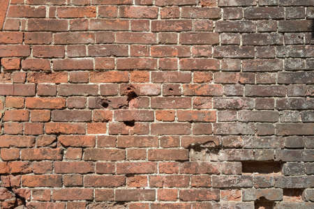 Old red brick wall texture and grunge background to any interior design.