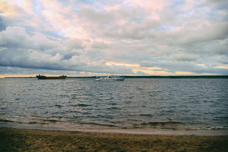 Storm at sea. A scenic view of the stormy sea against a dramatic sunset sky. Beautiful sky and sea...