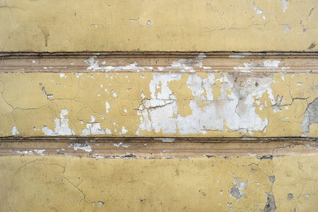 Old concrete wall with texture of dirty peeling stucco.の写真素材