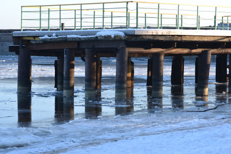 Mooring post in winter. Wharf in winterの写真素材