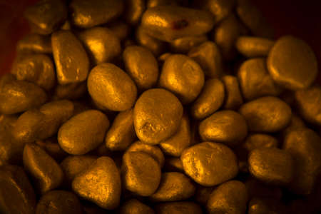 Heap of golden stones together. Horizontal.