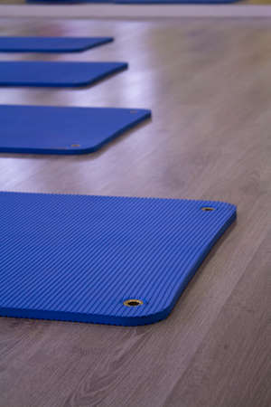 Blue fitness mats on floor.の写真素材