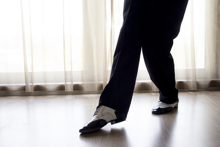 Man dancing with black and white shoes.の写真素材