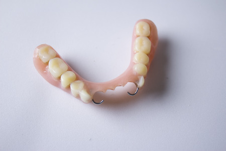 Studio shot of a denture, false teeth, isolated on white.の写真素材
