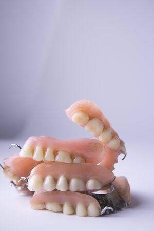 Studio shot of a various dentures, false teeth, isolated on white.の写真素材