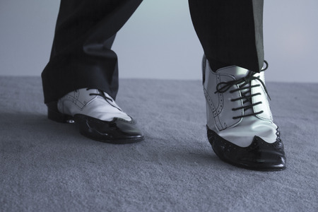 Dancing shoes feet of male ballroom, latin, salsa and swing dancerの写真素材