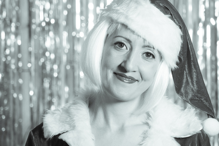 Woman dressed in red as Santa Clausの写真素材