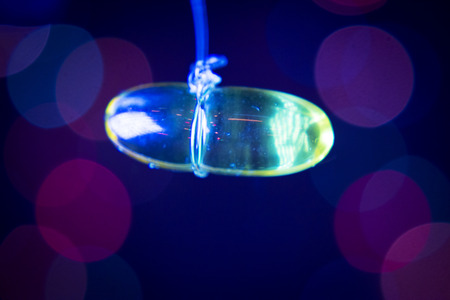 Fish oil capsule on dark backgroundの写真素材