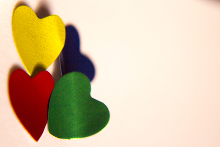 Red and gold shiny hearts isolatedの写真素材