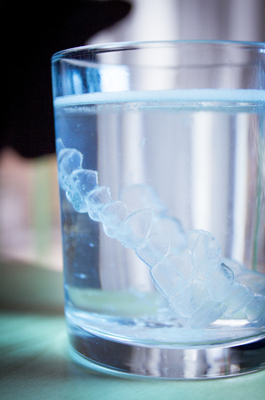 Invisible dental orthodontic submerged in water for cleaningの写真素材
