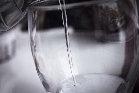 Open water bottle to serve in a glass