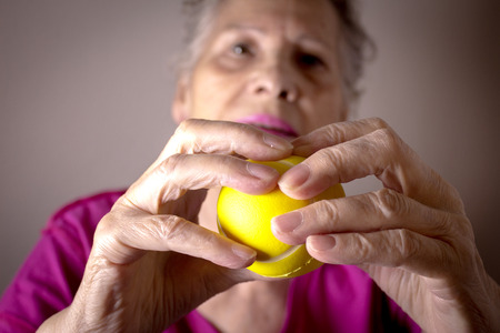 Rehabilitation exercises for an older woman with cerebral strokeの写真素材