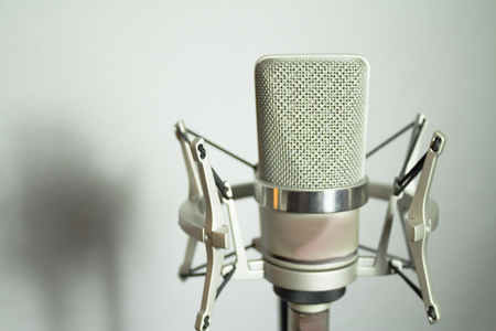 Professional microphone silver on white backgroundの写真素材