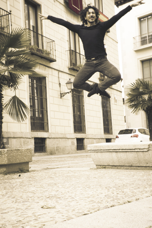 Male dancer performing jump in the air. Urban backgroundの写真素材