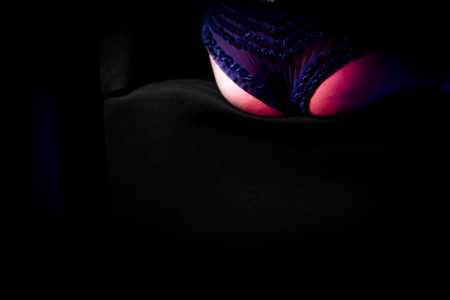 Backside of sexy woman in intimate clothes. Night club sceneの写真素材