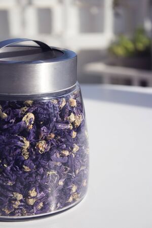 Pot with natural dried chamomile infusion. Isolatedの写真素材