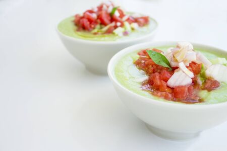 Green cucumber and tomato gazpacho. Healthy, vegetarian and vegan foodの写真素材