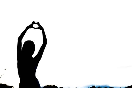 Young athlete girl doing yoga asanas with natural backgroundの写真素材