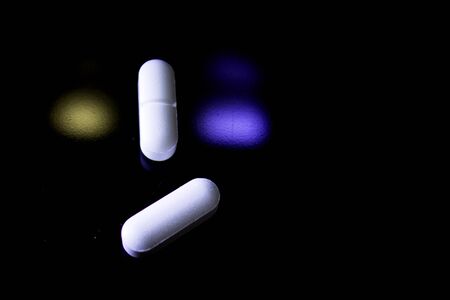 Woman holding generic white medicine pillsの写真素材