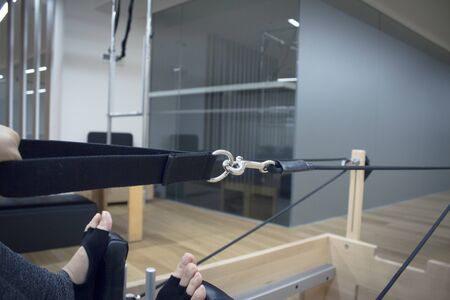 Woman doing pilates machine exercisesの写真素材