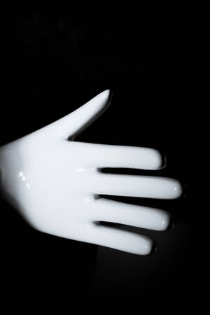White mannequin hand. Palm down. No peopleの写真素材