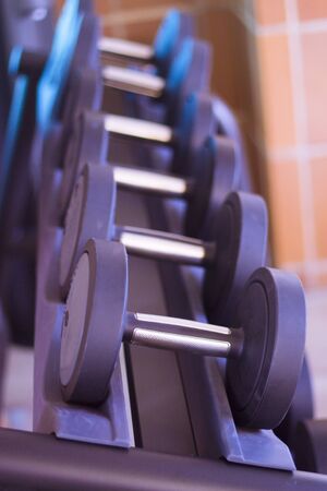 Black dumbbells in gym room. No peopleの写真素材