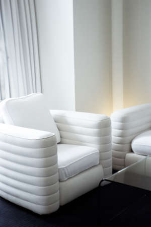 White sofas in luxury hotel room. No people