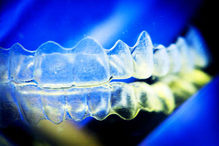 Invisible dental orthodontic submerged in water for cleaning