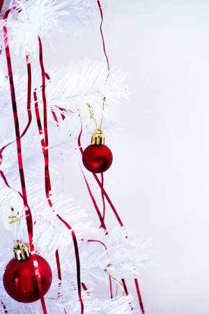 White christmas tree with red decorations. No peopleの写真素材