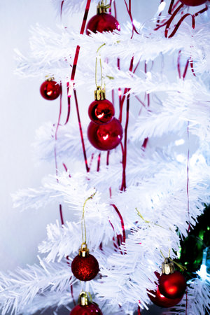 White christmas tree with red decorations. No peopleの写真素材
