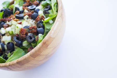 Quinoa, lettuce, lambs lettuce, black olives and cucumber salad. No peopleの写真素材
