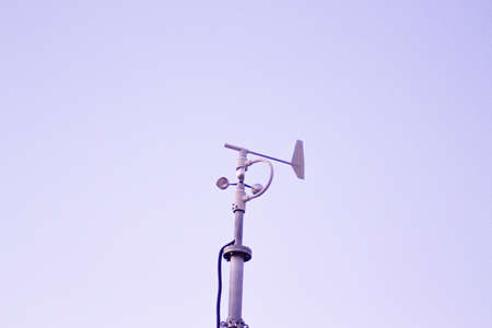 Weather station in silhouette over the sky at sunset. No peopleの写真素材