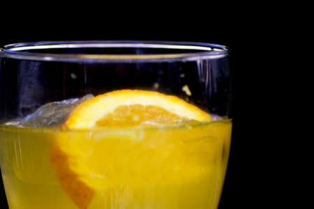 Orange soda in a crystal glass with a piece of natural orange. No peopleの写真素材