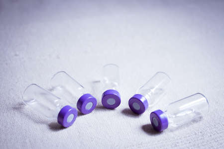 Empty glass jars of coronavirus vaccines. No peopleの写真素材